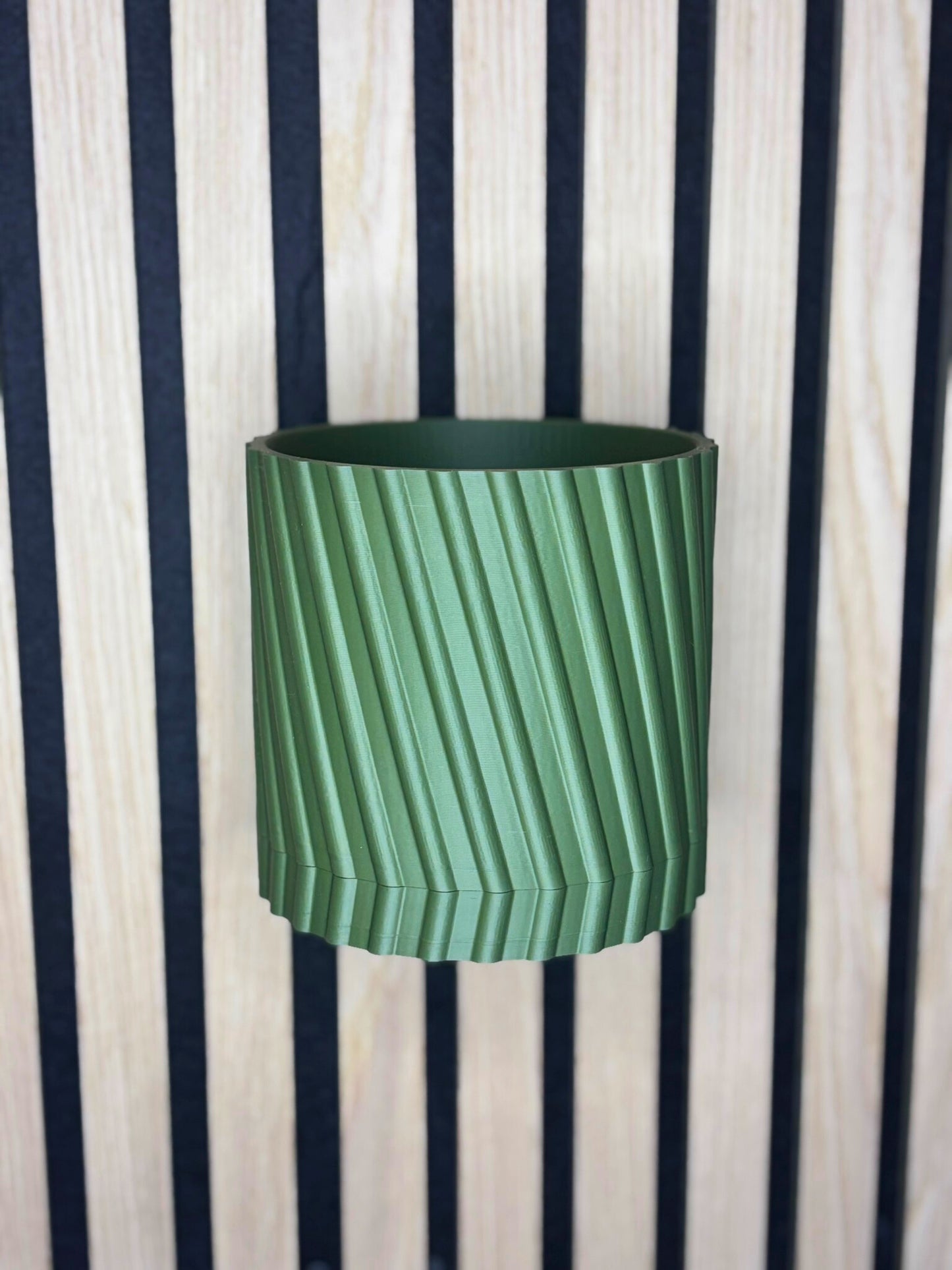 Väggmonterad blomkruka